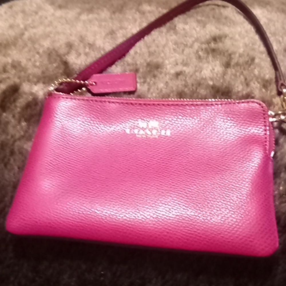 Coach raspberry color  wristlet like new